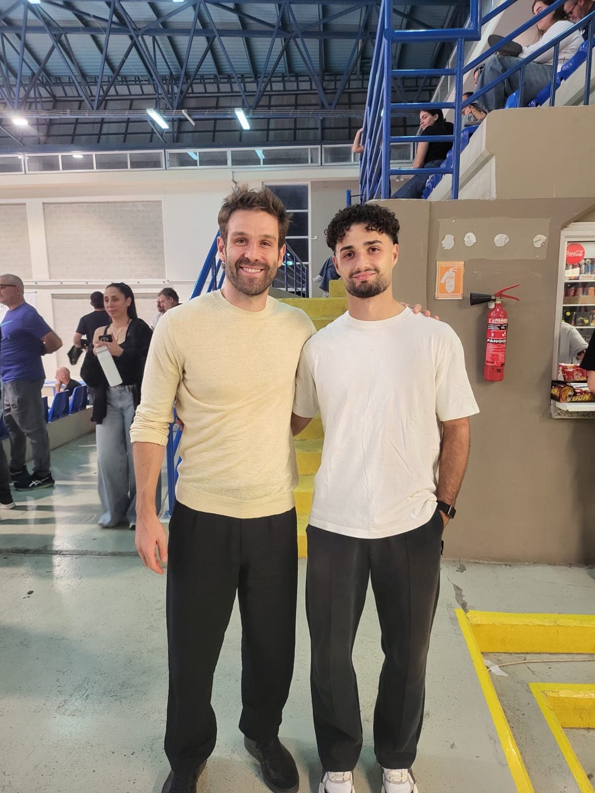 Michael Dellios of Akritas Chlorakas with David Goldar of Pafos FC at the volleyball match in Paphos
